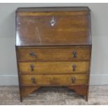 A mahogany bureau having a fall front over three drawers