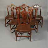 A set of six mahogany Hepplewhite style dining styles, each having an arched back, moulded frame,