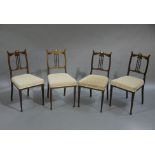 A set of four Edward VII walnut salon chairs,