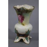 A Royal Worcester vase of compressed globular shape with inverted neck painted with yellow and pink