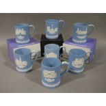 Seven Wedgwood blue jasper dip Christmas mugs, various scenes and dates,