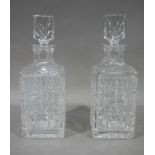 A pair of cut glass spirit decanters of square outline