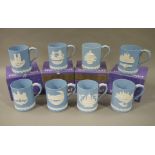 Eight Wedgwood blue jasper dip Christmas mugs, various scenes and dates,