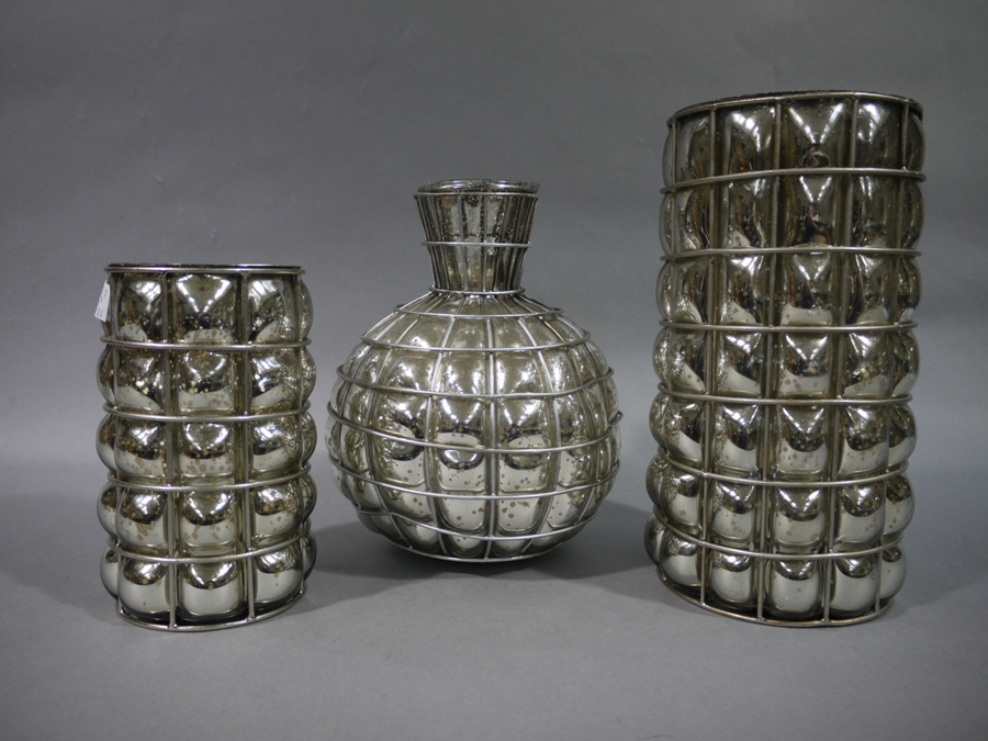 Three silver lustre 'bubble' glass and mesh vases