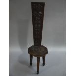 A mahogany chip carved spinning wheel dated 1908 to the back board,