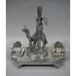 A Victorian silver plated desk standard with epergne modelled as Arab on camel back with attendant