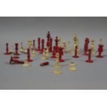 A late 19th/early 20th century natural and red stained ivory chess set