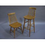 An Ercol style stick back single chair and matching breakfast bar chair