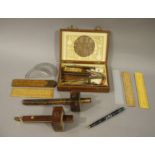 Two 19th century rosewood and brass inlaid scribes together with a Rabone boxwood and brass folding