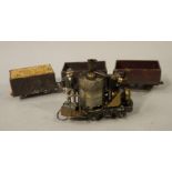 A model steam engine on dublo base with platform and figure,