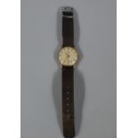 A gentleman's deluxe wristwatch by Smiths in 9ct gold case c.