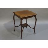 A mahogany window table of square outline with under-tier and on cabriole legs