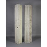 A pair of two fold white painted window shutters, having fielded panels,