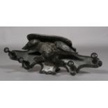 A Victorian ebonised oak hall rack carved as an eagle with outstretched wings with four turned