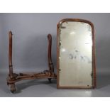 A Victorian mahogany cheval mirror having serpentine upright, arched rectangular glass,