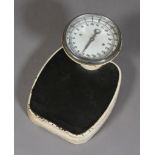 A set of 1930s personal weighing scales,