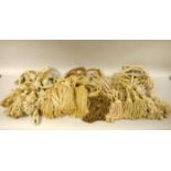A pair of natural 'string' curtain tie backs together with a set of six tasselled tie backs,