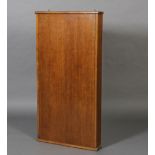 An oak wall key cabinet, with single door, the inside with 52 numbered hook,