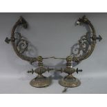 A pair of Victorian lacquered brass wall light bracket, having a circular wall plate,