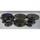A quantity of Victorian ebonised dome stands,