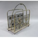 An Edward VII oak and brass magazine rack with wire mesh sides decorated with applied gilt metal