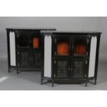 A pair of Aesthetic Movement ebonised mahogany cabinets, of chamfered rectangular outline,