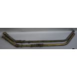 A pair of Victorian lacquered brass curtain poles for bay windows,