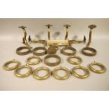Three pairs of Victorian brass and copper curtain pole brackets with flowerhead finials,