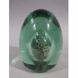 A Victorian green glass dump or paperweight,