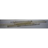 Assorted Victorian lacquered brass curtain poles, two with jointed angles,