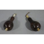 A pair of late Victorian/Edwardian rosewood and bone pendant light switches of baluster outline,