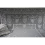 A pair of Edwardian lace curtains and three single lengths of differing designs (5)