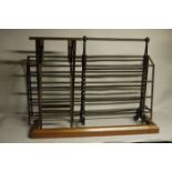 A tubular metal boot rack, 134cm wide x 70 cm high, together with an oak fire curb,