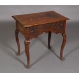 A rectangular oak side table, rectangular, the frieze carved with roundels,