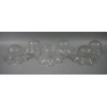 A set of six Edwardian clear and etched glass light shades with wavy rims, 14.5cm diameter x 8.
