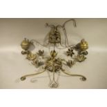 A pair of Victorian gilt metal twin light rise and fall ceiling pendants each with scrolled twin