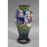 Moorcroft - An orchid pattern vase of baluster form,