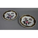 A pair of early 19th century English porcelain shaped circular cabinet plates,