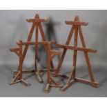 A pair of brown painted estate made game hangers of A frame 150cm high together with a smaller pair,
