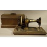 An early 20th century Jones hand sewing machine with gilt decoration