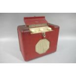 A vintage Roberts Radio, number 55769 in red case with ivorine octagonal speaker cover,