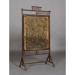 A late 19th century aesthetic bamboo framed firescreen,