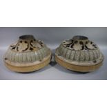 A pair of Victorian painted metal ceiling lights of circular domed outline with a pierced leaf