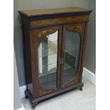 A Victorian rosewood display cabinet inlaid in harewood and satinwood with ribboned harebell swags