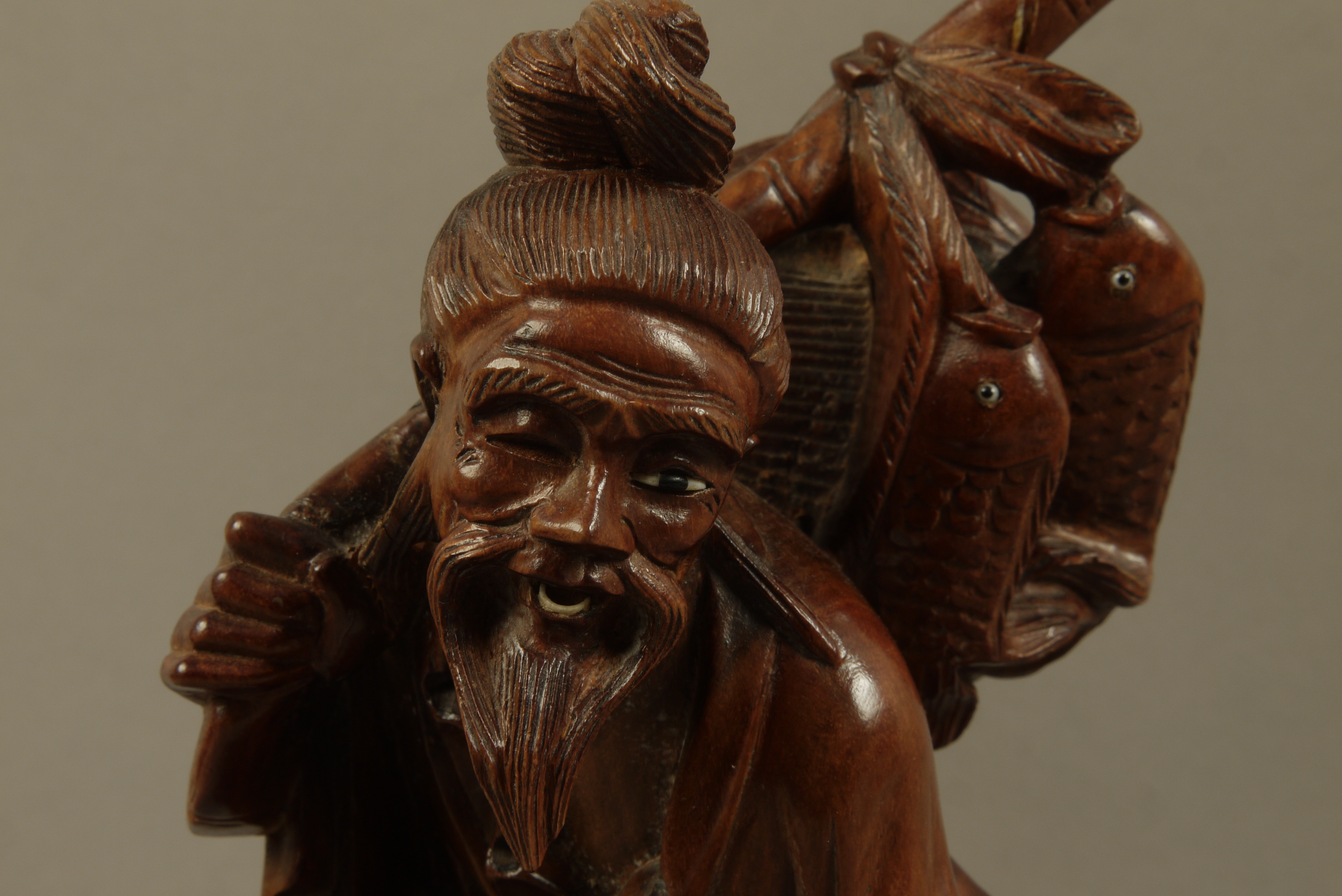 A Chinese hardwood figure of a bearded gentleman and infant holding fish over his shoulder and in - Image 3 of 3