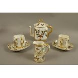 A Royal Worcester aesthetic movement teapot and cover the flat sided rounded body moulded in