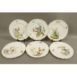 A set of six shaped circular cabinet plates each printed and painted with a different bird and