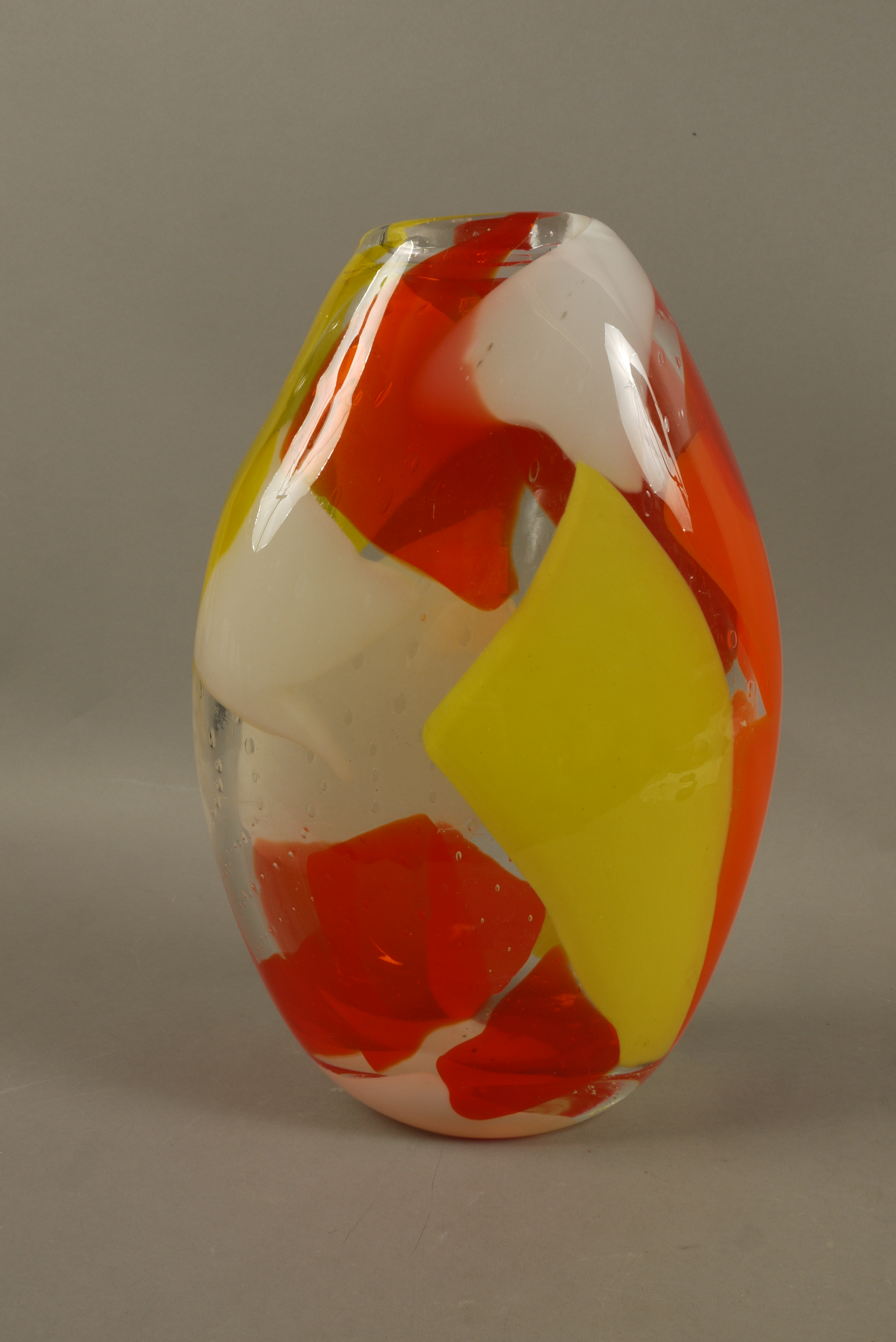 A Mdina modernist glass vase of irregular orange, yellow and white shapes,