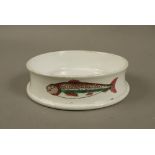 A Bisto pottery sardine dish of conventional cylindrical form printed and painted with sardines,