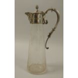 A late Victorian cut glass claret jug with silver plated foliate scroll handle,